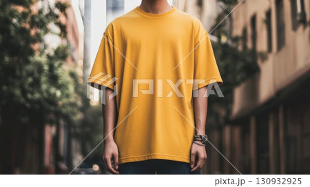 Model is wearing blank T-Shirt. Mockup For Your Design 130932925