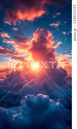 Sunset in the sky among clouds, a vivid and dramatic sky is filled with clouds that are illuminated by the sun, creating a vibrant play of colors 130933165
