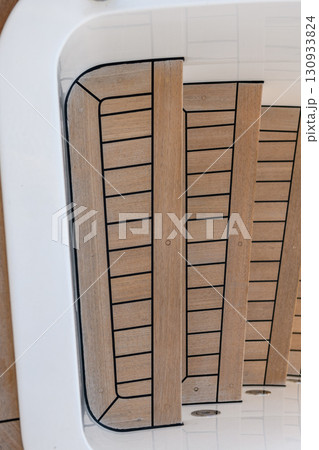 Teak stairs ladder on luxury yacht. Elements of yacht construction. Superyacht concept. Teak stairs ladder on luxury yacht. Elements of yacht construction. Superyacht concept. 130933824