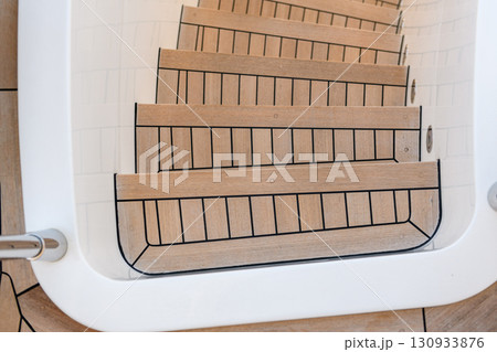 Teak stairs ladder on luxury yacht. Elements of yacht construction. Superyacht concept. Teak stairs ladder on luxury yacht. Elements of yacht construction. Superyacht concept. 130933876