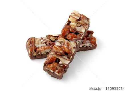 two sweet nut caramel bars isolated on white background. two sweet nut caramel bars isolated on white background. 130933984