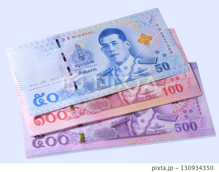 Explore the details of Thai currency with a close-up of a 20 baht bill showcasing intricate designs and symbols from Thailand Explore the details of Thai currency with a close-up of a 20 baht bill showcasing intricate designs and symbols from Thailand 130934350