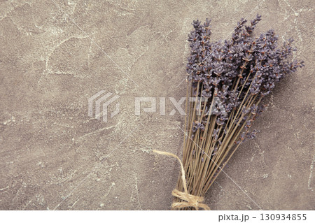 Lavender flowers on grey concrete background. Floral composition. 130934855