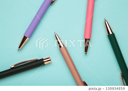 New stylish colorful pens on blue background. New stylish colorful pens on blue background. 130934859