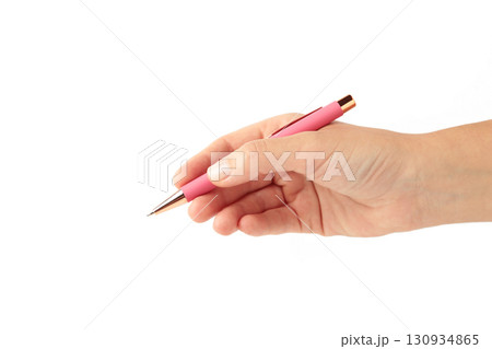 Young woman holding pink pen isolated on white background, closeup Young woman holding pink pen isolated on white background, closeup 130934865