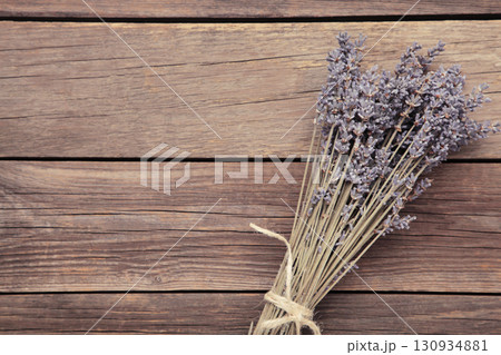 Lavender flowers on grey concrete background. Floral composition. 130934881