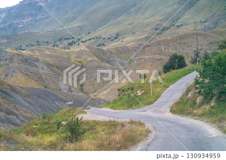 A road with a sign that says "One Way" is shown in the distance A road with a sign that says "One Way" is shown in the distance 130934959