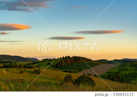 Landscape of the hills on the outskirts of Kamienna Gora during beautiful sunset on a summer afternoon, Lower Silesia, Poland. 130935115
