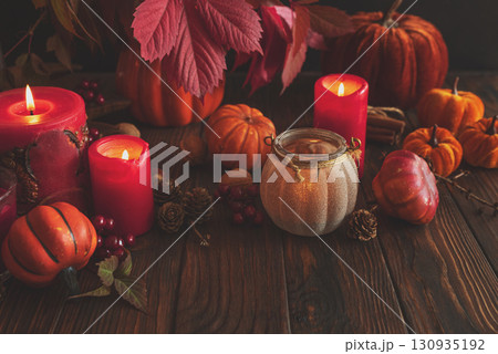 Autumn Still Life with Pumpkins, Candles and Seasonal Decorations 130935192