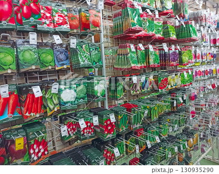 Seed packets on shelves in garden store. Seeds are sold in the agricultural store Seed packets on shelves in garden store. Seeds are sold in the agricultural store 130935290