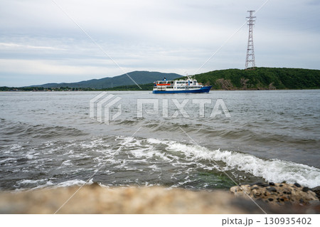 Scenic view of a ferry sailing in Vladivostok's coastal waters 130935402