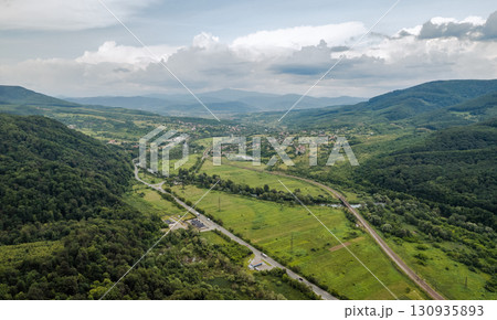 Green hills and forest landscape in summer. Chynadiieve, Ukraine. 130935893