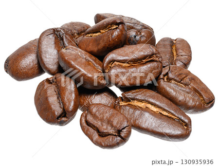 A handful of roasted coffee beans, shot close-up on an isolated background 130935936