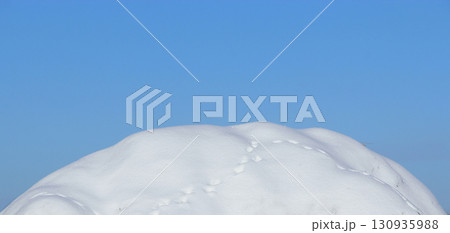 Winter landscape. Snowy hill against blue sky. Frosty weather Winter landscape. Snowy hill against blue sky. Frosty weather 130935988