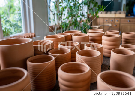 Terracotta pots in different sizes in plant shop 130936541