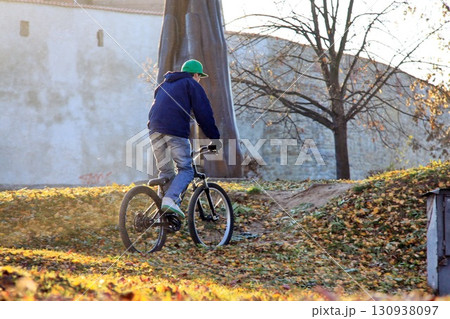 riding a mountain bike 130938097