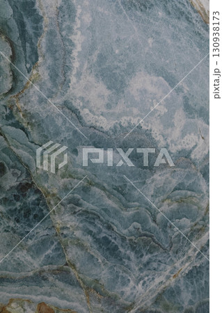 Natural blue stone surface with intricate patterns found in a geological formation Natural blue stone surface with intricate patterns found in a geological formation 130938173