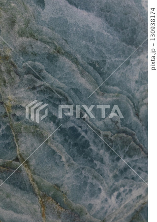 Beautiful close-up of blue marble showing intricate patterns and textures in natural stone formation 130938174