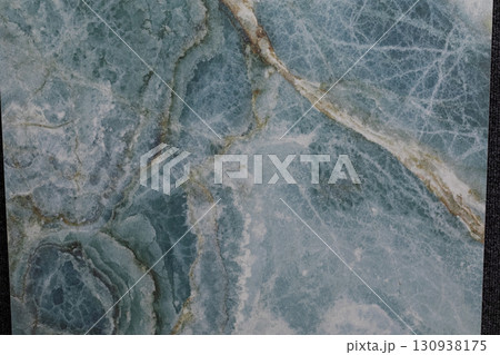 Unique blue marble with intricate patterns and textures found in a natural stone shop Unique blue marble with intricate patterns and textures found in a natural stone shop 130938175