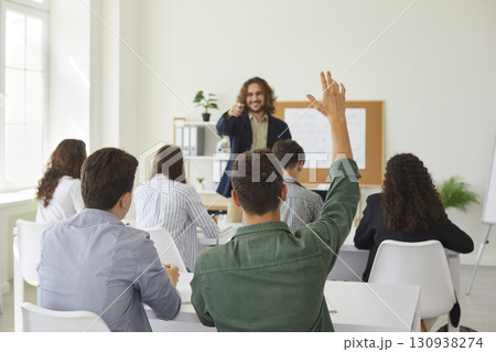 Teenage Schoolboy Raising Hand During Lesson 130938274