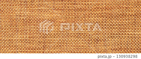 Orange woven textile macro texture background. Knitted amber fabric pattern for material design and backdrop Orange woven textile macro texture background. Knitted amber fabric pattern for material design and backdrop 130938298
