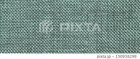Dark green woven textile macro texture background. Knitted teal fabric pattern for material design and backdrop 130938299