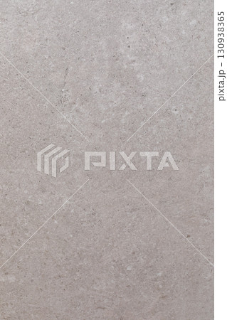 Close-up view of light gray concrete texture showing subtle variations in color and pattern during Close-up view of light gray concrete texture showing subtle variations in color and pattern during 130938365