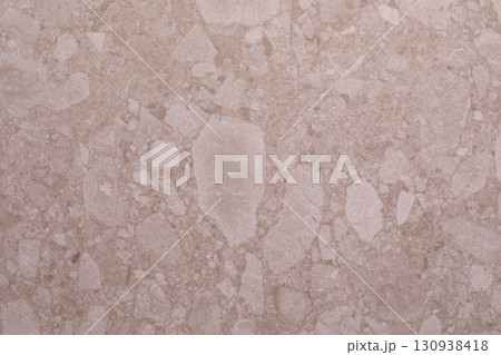 Natural stone surface with unique textures and patterns showcasing elegant light beige tones and Natural stone surface with unique textures and patterns showcasing elegant light beige tones and 130938418