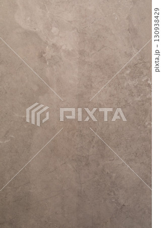 Textured wall surface displaying natural patterns and subtle color variations in a minimalist Textured wall surface displaying natural patterns and subtle color variations in a minimalist 130938429