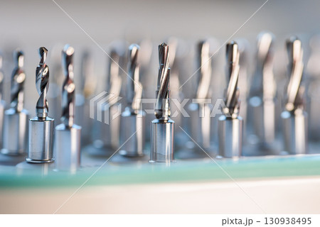 Full set of dental implant drill bits in surgical tray, close-up of professional dentistry equipment Full set of dental implant drill bits in surgical tray, close-up of professional dentistry equipment 130938495