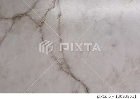 Elegant marble surface showcasing intricate veining patterns in soft gray tones Elegant marble surface showcasing intricate veining patterns in soft gray tones 130938611