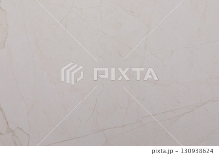 Light-colored marble surface with subtle veining and texture perfect for interior design Light-colored marble surface with subtle veining and texture perfect for interior design 130938624