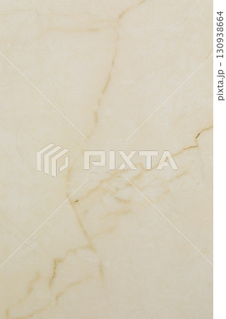Light beige marble surface with subtle patterns and variations in texture and color displaying Light beige marble surface with subtle patterns and variations in texture and color displaying 130938664