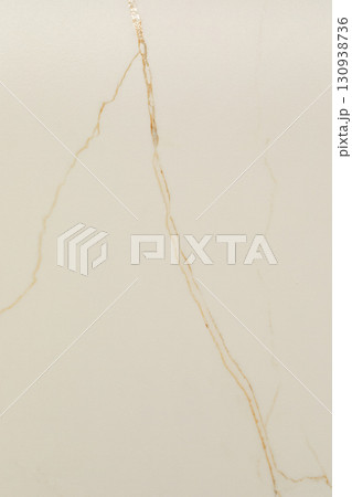 Elegant beige marble with subtle gold veining in a smooth polished finish ideal for interior design 130938736