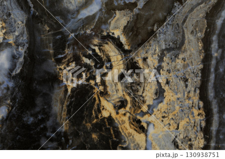 Abstract patterns and textures in a natural stone resembling intricate geological formations at 130938751