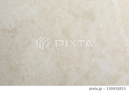 Natural stone surface showcasing a smooth, light beige texture perfect for home design and Natural stone surface showcasing a smooth, light beige texture perfect for home design and 130938853