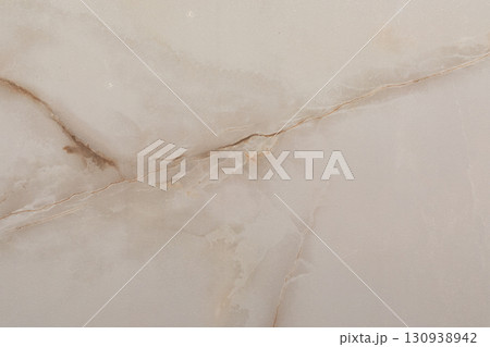 Beautiful light beige marble surface with natural patterns and veins, suitable for elegant interiors 130938942