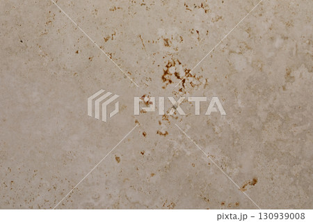 Textured surface shows natural stone pattern with earthy tones in a modern interior design setting 130939008