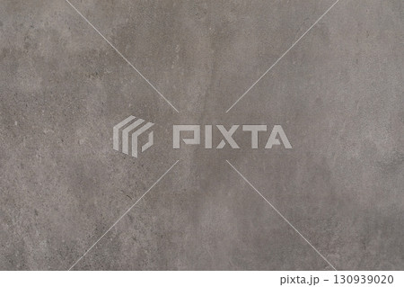 Concrete wall texture with subtle color variations and a smooth finish in natural light Concrete wall texture with subtle color variations and a smooth finish in natural light 130939020