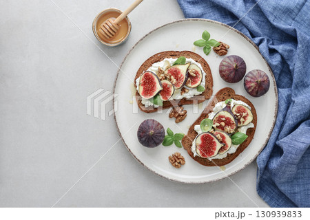 Sandwiches with figs, cream cheese, basil and honey Sandwiches with figs, cream cheese, basil and honey 130939833