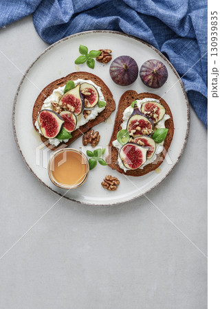 Sandwiches with figs, cream cheese, basil and honey Sandwiches with figs, cream cheese, basil and honey 130939835