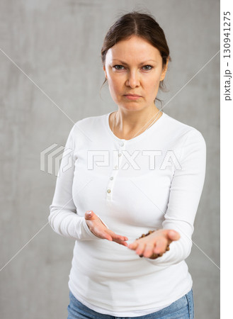 Unhappy annoyed woman argues with fury anger and frustration Unhappy annoyed woman argues with fury anger and frustration 130941275