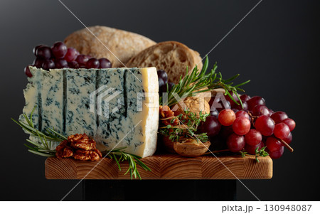 Gorgonzola cheese with ciabatta, walnuts, grapes, and aromatic herbs. 130948087