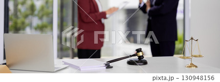 Legal Professionals Discuss Law Documents Modern Office Setting Consultation Meeting Justice System Work 130948156