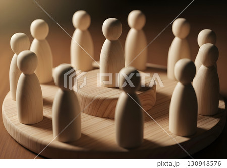 Wooden figures arranged in a circle, symbolizing unity and teamwork concept. 130948576