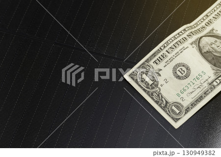 Solar panel with dollar bill Solar panel with dollar bill 130949382