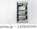 Full view of electrical distribution panel with circuit breakers 130949390