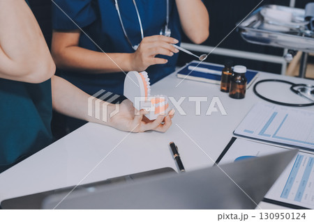 dentist consultation - patient visit at dental clinics office dentist consultation - patient visit at dental clinics office 130950124