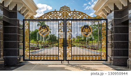 Grand ornate golden gate of Istana Negara, the National Palace, with Malaysia's Coat of Arms, Kuala Lumpur, Malaysia 130950944