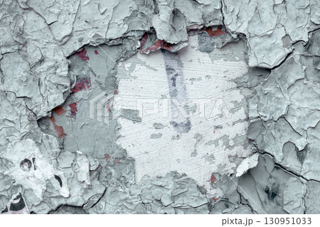 Old wall with peeling and cracked paint. Texture of gray background and cracks. Old wall with peeling and cracked paint. Texture of gray background and cracks. 130951033